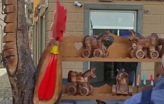 Hand-carved wooden Tatà, the classic wheeled toy of the Valdostan tradition